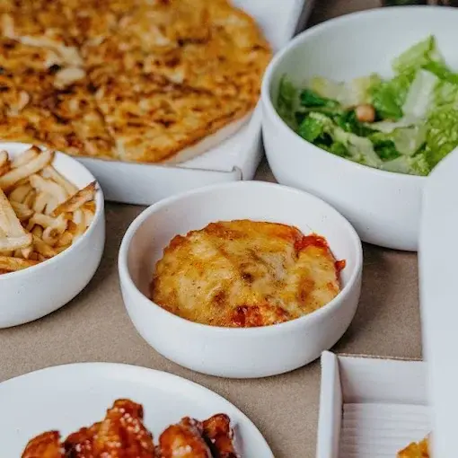 Authentic Greek-style pizza at Estoria Pizzeria Calgary