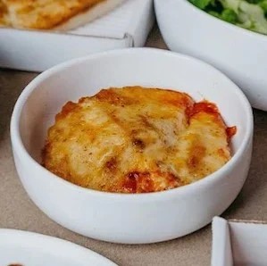 Carbonara pizza with Alfredo sauce, grilled chicken and bacon at Estoria Pizzeria Calgary